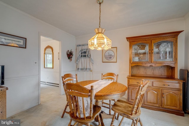 dining space featuring baseboard heating, light colored carpet, and ornamental molding