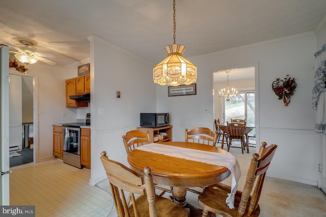 dining area featuring crown molding and baseboard heating