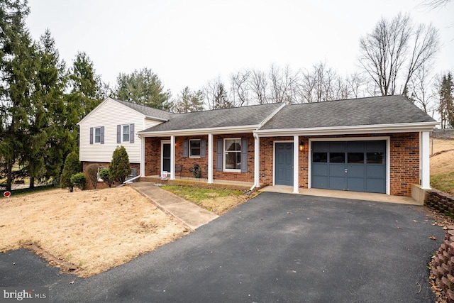 view of front of house with a garage and covered porch