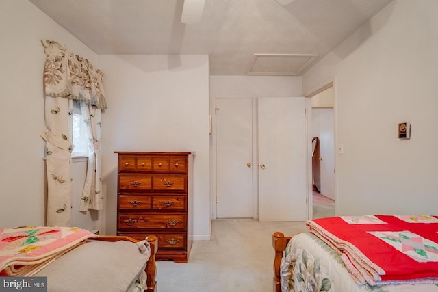 bedroom featuring ceiling fan and light carpet