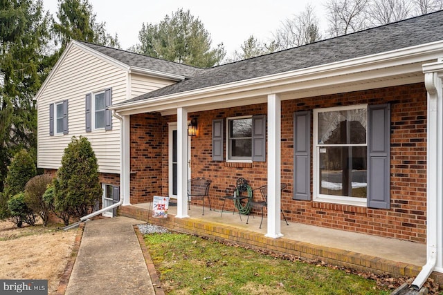 split level home with covered porch