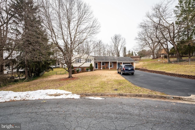 view of front of property with a garage and a front yard