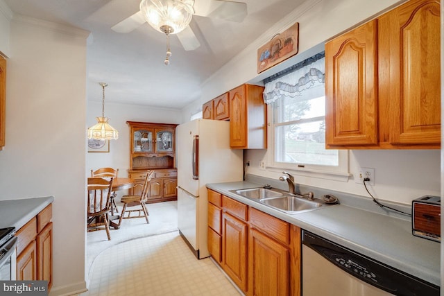 kitchen with sink, hanging light fixtures, white refrigerator, ornamental molding, and stainless steel dishwasher