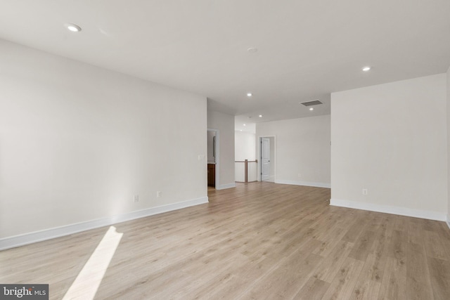 unfurnished room with light hardwood / wood-style floors