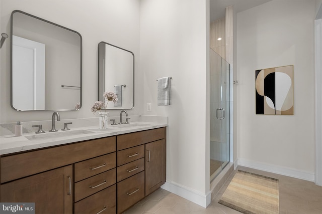 bathroom featuring vanity, tile patterned flooring, and a shower with door