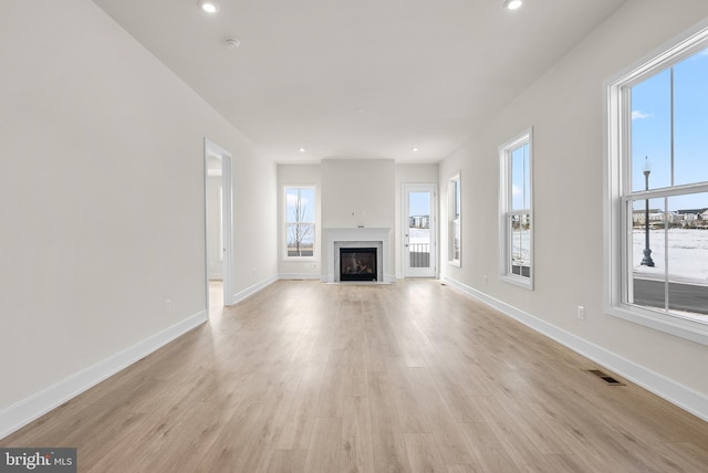 unfurnished living room with light hardwood / wood-style floors