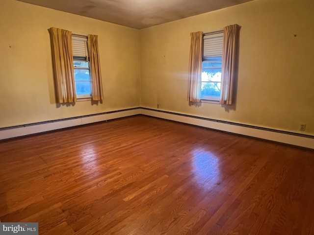 spare room featuring hardwood / wood-style flooring