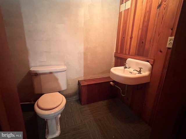 bathroom featuring sink, tile patterned floors, and toilet