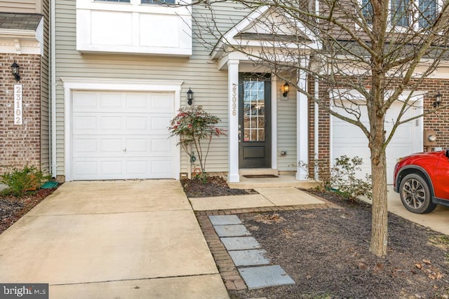 view of property featuring concrete driveway