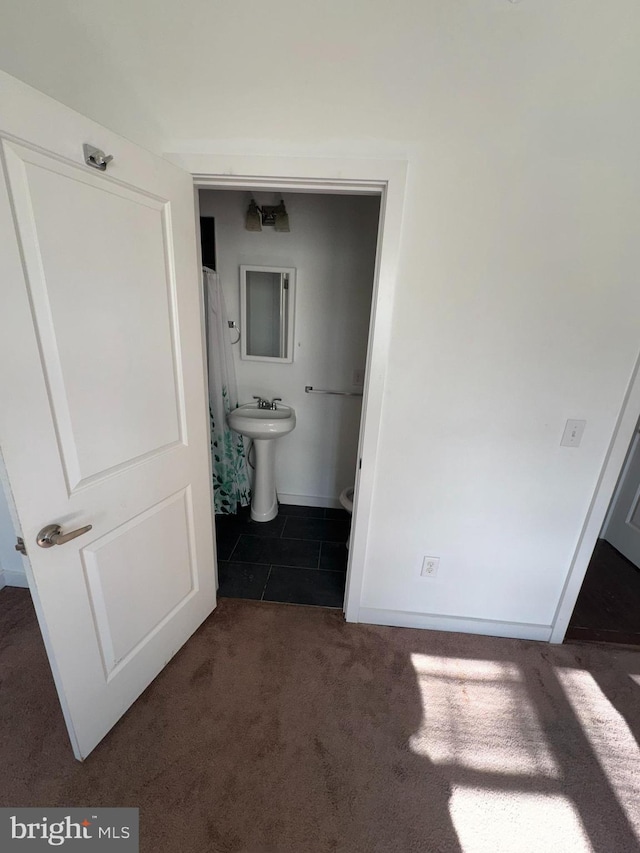 bathroom with tile patterned flooring and sink