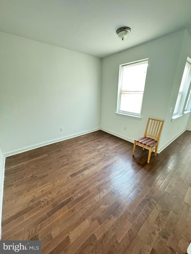 spare room featuring dark hardwood / wood-style floors