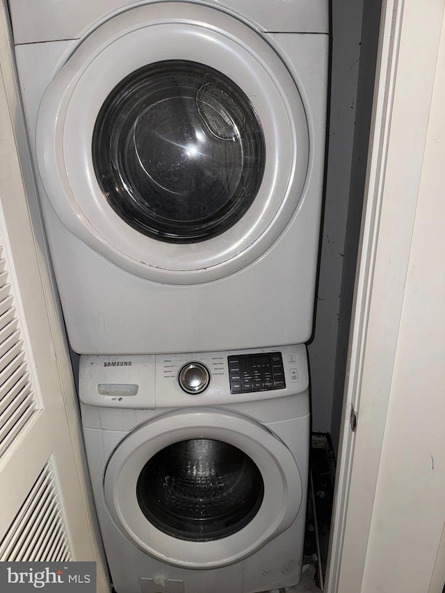 washroom with stacked washer and clothes dryer