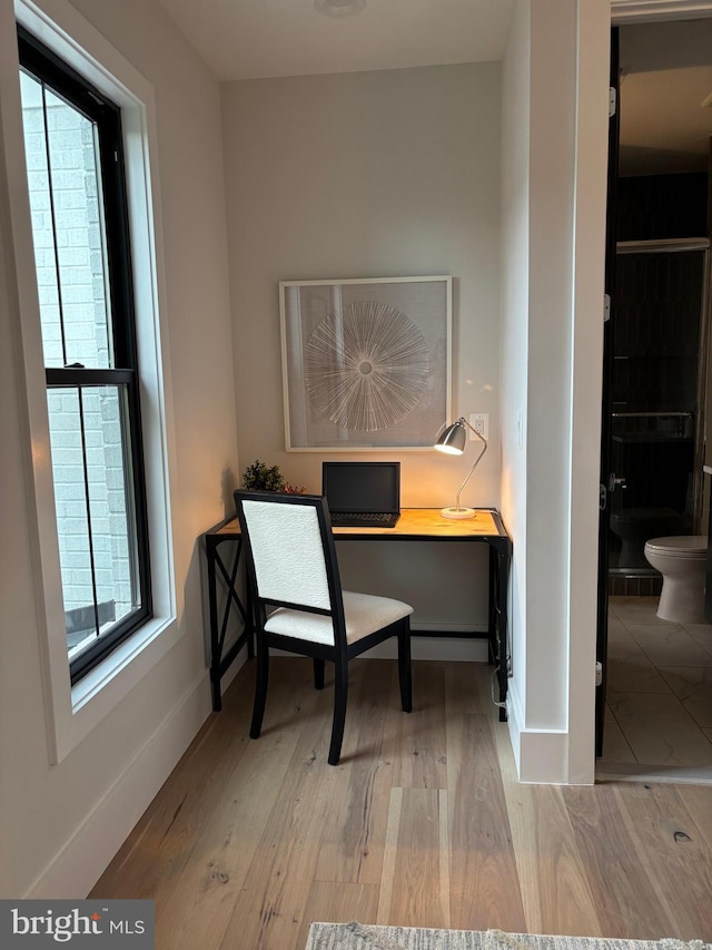 office featuring wood finished floors and baseboards