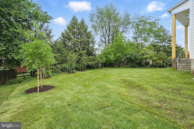 view of yard featuring stairs