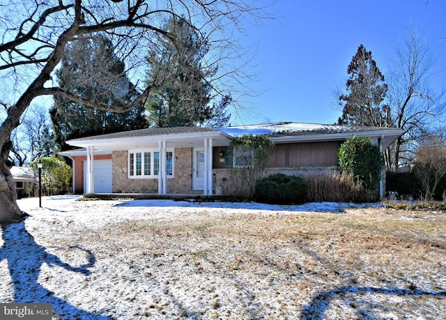 ranch-style home featuring a garage