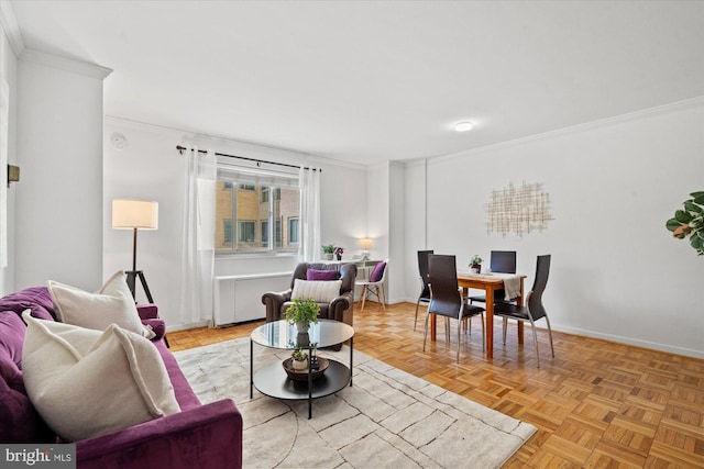 living room featuring ornamental molding and light parquet floors