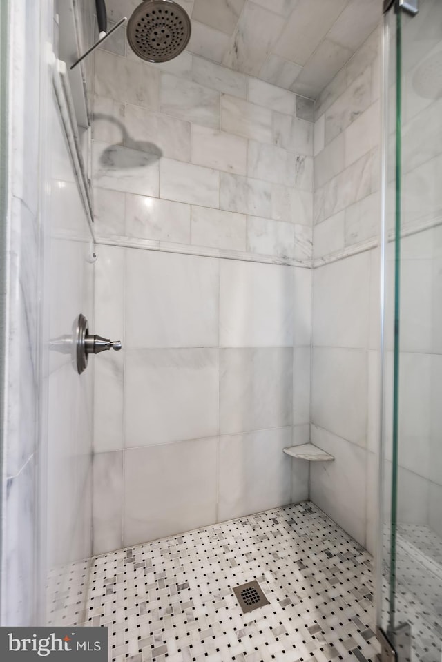 bathroom with a shower stall