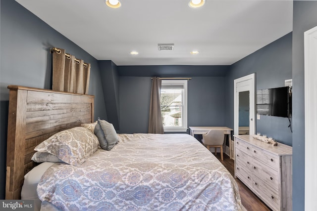 bedroom featuring dark wood-type flooring, recessed lighting, and visible vents