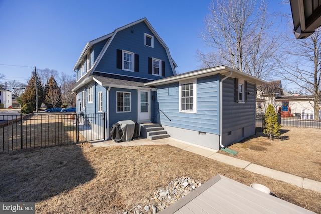 view of front of house with entry steps, a shingled roof, fence, a gambrel roof, and crawl space