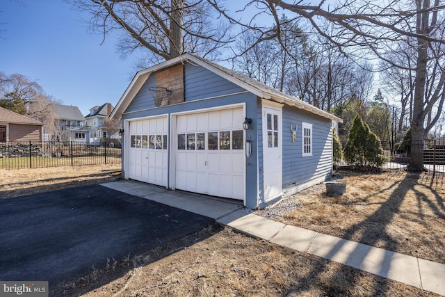 detached garage with fence