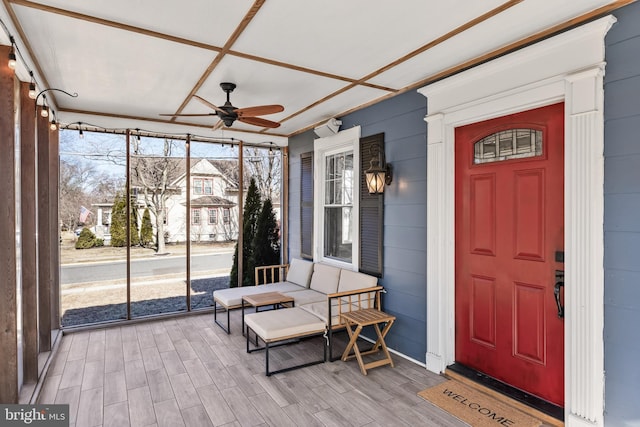 exterior space featuring a ceiling fan