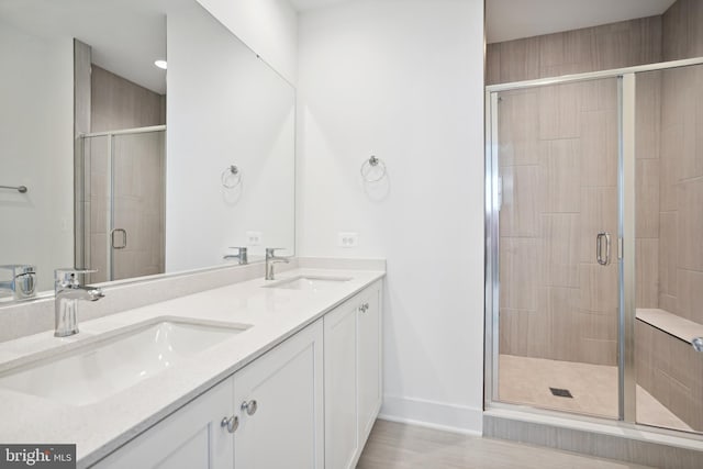 bathroom with vanity and walk in shower