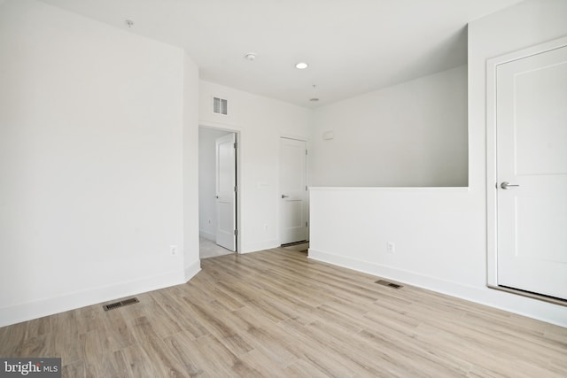 spare room featuring light hardwood / wood-style floors