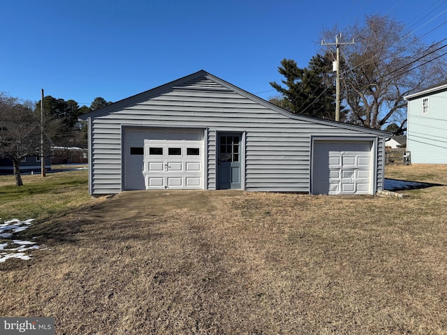 garage featuring a lawn