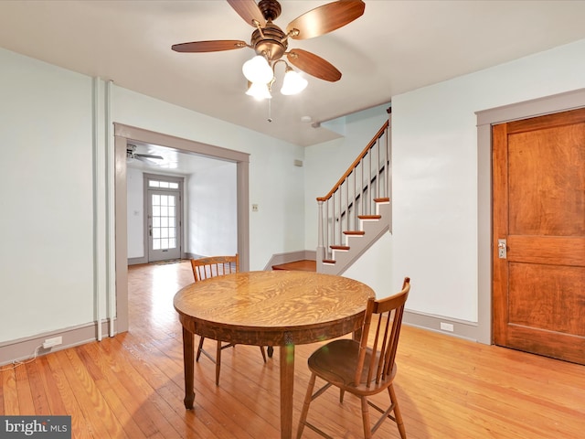 dining area featuring ceiling fan and light hardwood / wood-style flooring