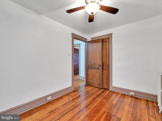 unfurnished room featuring hardwood / wood-style flooring