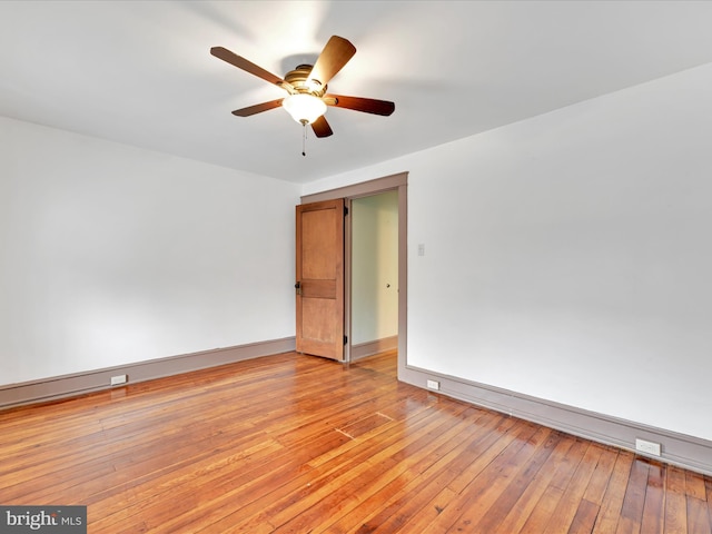 unfurnished room with light hardwood / wood-style floors and ceiling fan