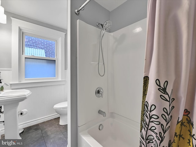 full bathroom with sink, shower / bathtub combination with curtain, tile patterned floors, and toilet