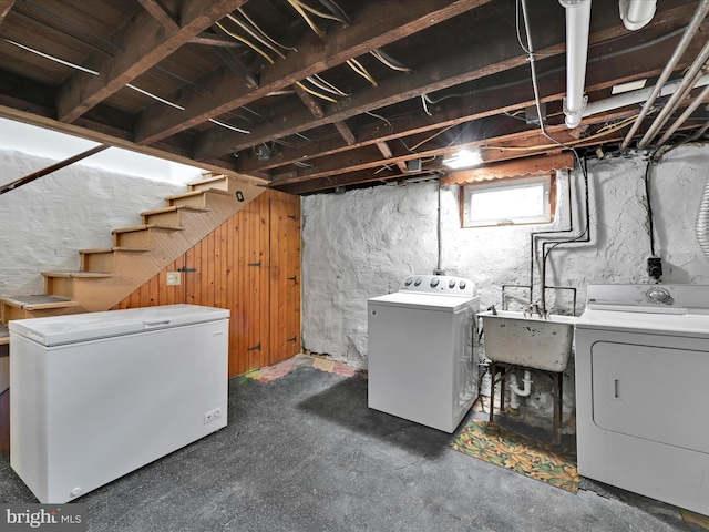 basement with separate washer and dryer, sink, and refrigerator