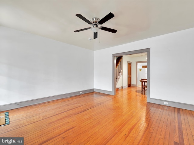 empty room featuring ceiling fan and light wood-type flooring