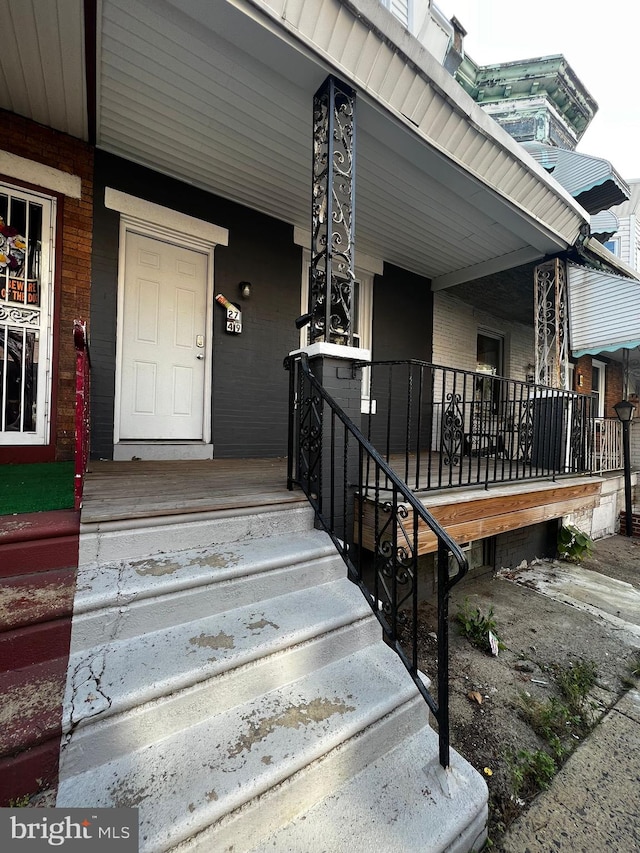 entrance to property with covered porch