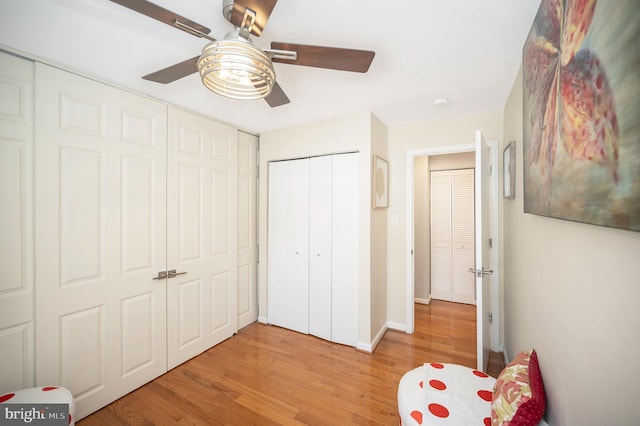 unfurnished bedroom featuring light hardwood / wood-style flooring and ceiling fan