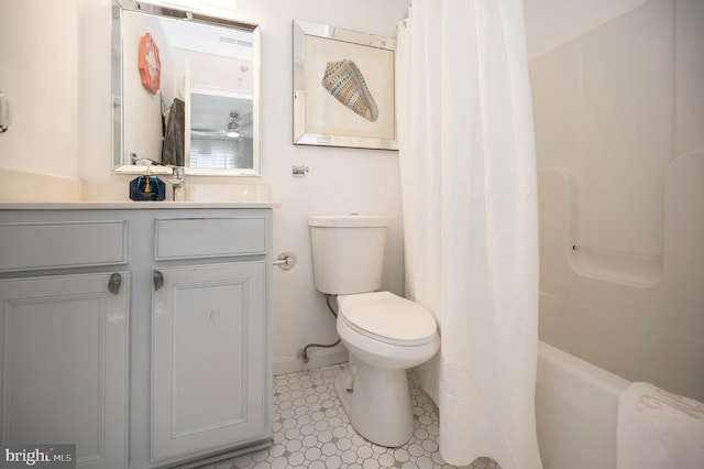 full bathroom featuring vanity, shower / tub combo, and toilet