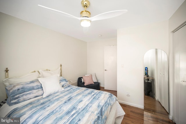 bedroom featuring dark hardwood / wood-style floors and ceiling fan