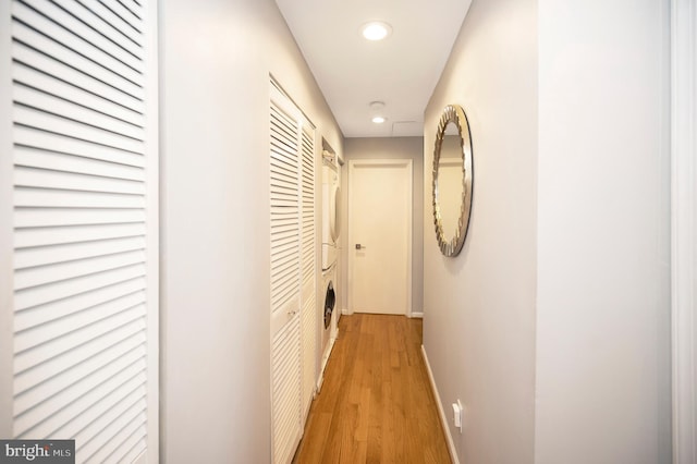 hallway with light hardwood / wood-style floors