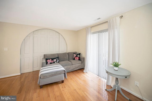 living room with light hardwood / wood-style flooring