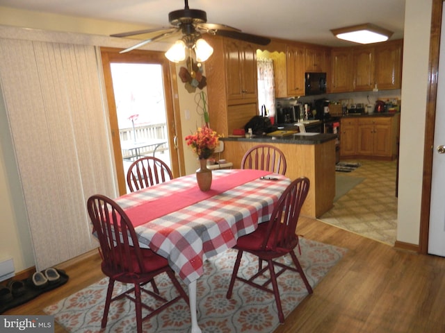 dining area with light wood-type flooring