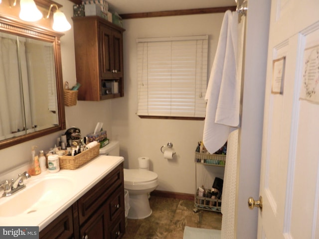 bathroom featuring vanity and toilet