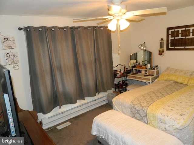 bedroom with baseboard heating, ceiling fan, and carpet floors