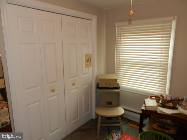 sitting room with a baseboard heating unit