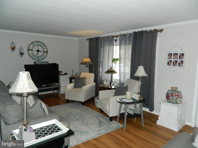 living room with hardwood / wood-style flooring and ornamental molding