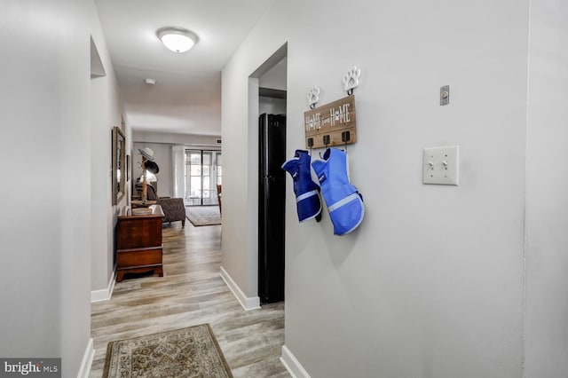 hallway featuring light hardwood / wood-style flooring