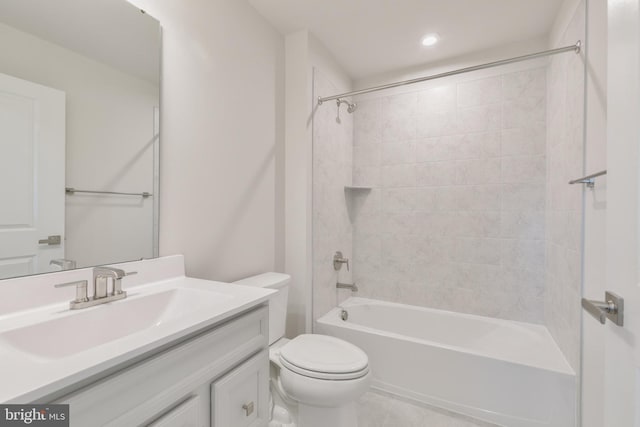 bathroom featuring bathing tub / shower combination, toilet, and vanity