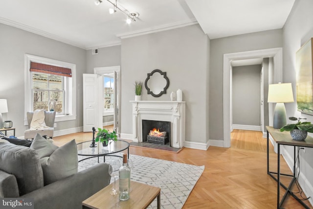 living room featuring ornamental molding and light parquet flooring