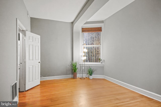 empty room featuring hardwood / wood-style floors