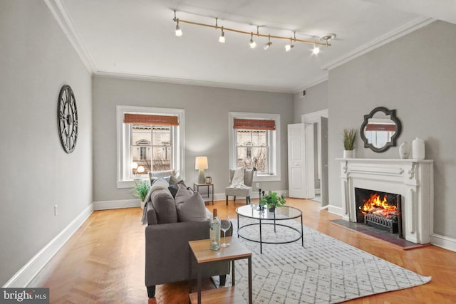 living room with crown molding, track lighting, and light parquet floors